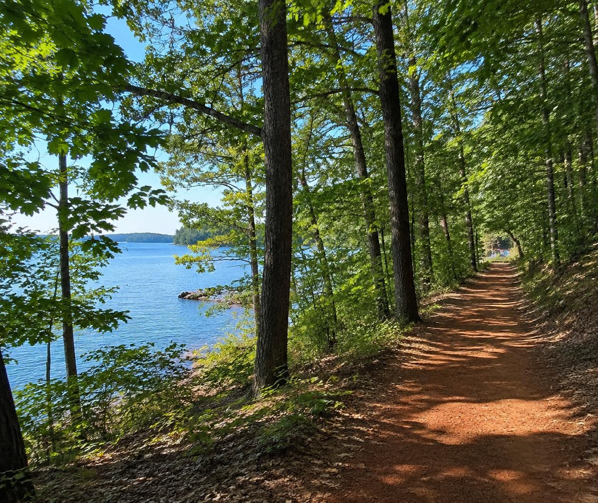 Illustrative wooded trail beside a North Carolina lake